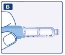 Close-up of a hand holding a transparent injector horizontally, showing the measurement scale and a blue handle section against a light background