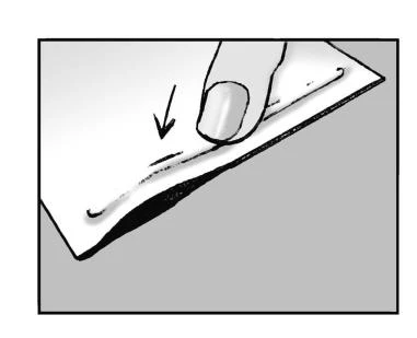 Finger pressing on the edge of a white package or product, with a black arrow indicating the direction of movement or point of pressure