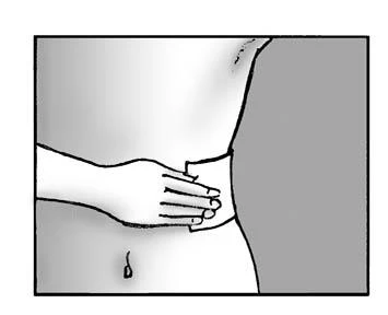 Hand applying a patch to the lower abdomen and side of the torso, pressing it onto the skin to secure the drug delivery