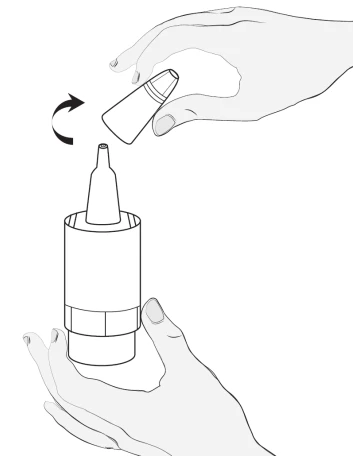 A hand holding a small container being rotated toward the upper part of a larger medical device indicated by an arrow