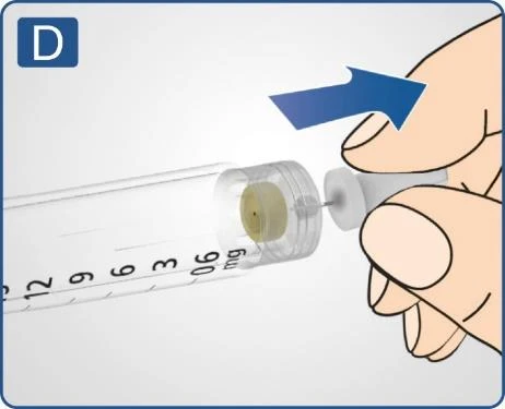 Hand removing a white needle shield from a syringe with a milligram scale, indicated by a blue arrow pointing to the right