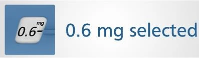 Close-up of a digital display showing 0.6 mg and adjacent blue text indicating selected dose of 0.6 mg