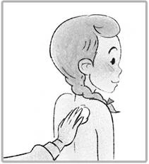 A hand holds a soft sponge and wipes the shoulder of a child standing in profile, with braids tied with a ribbon
