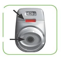 Silver device with digital display showing 60, red indicator, and a circular opening, marked with black arrows