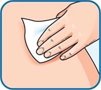 A hand wiping the skin with a cotton swab, preparing for injection