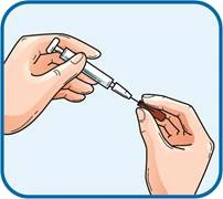 One hand holding a syringe, the other removing the needle from a vial of solution, preparing for injection