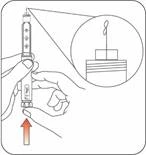 Hand holding a syringe, upward indicator showing direction for air removal from the needle, close-up image demonstrating air expulsion from the syringe