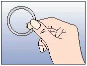 A hand holding a transparent ring applicator