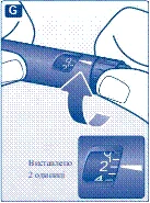 Hand holding a syringe with dosage markings, setting a dose of 2 units, close-up view showing the scale with numbers 2 and 4