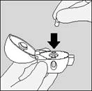 Hand holding an open container, a drop of liquid falling from a pipette into it from above, direction indicated by a downward arrow