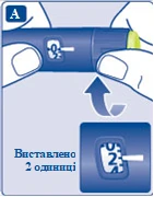 Ręka trzyma niebieską ruchomkę strzykawki, obracając regulator dawki w górę, na wyświetlaczu wskazana dawka 2 jednostki