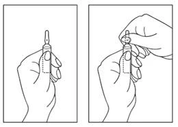 A hand holding an injection pen, preparing for injection