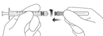 Two hands connecting a syringe to an ampoule, screwing them together to fill the syringe with solution